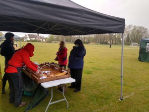 Customers and stall holders braving the elements