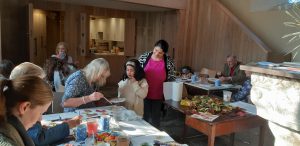 Image of a young participant getting guidance from Helen