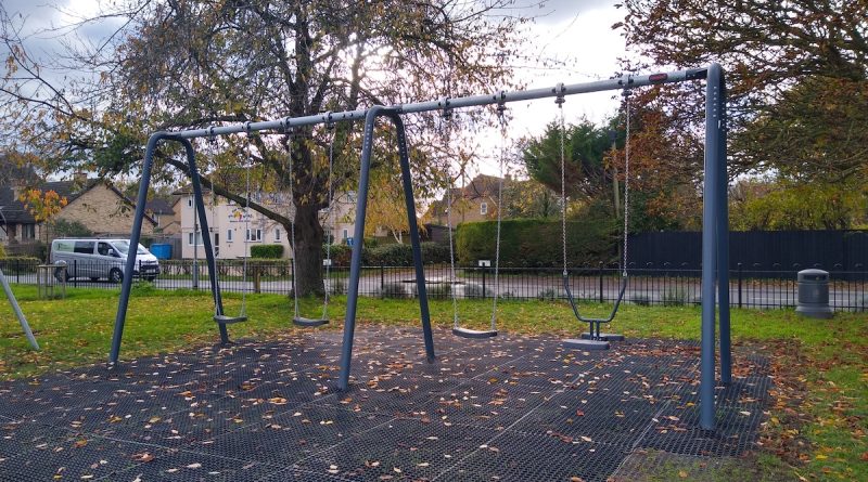 Image of the village playground swings