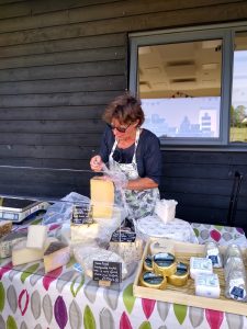 Woman at the Cheese stall outside the Memorial Hall