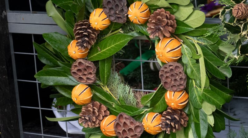 Christmas wreath with oranges, pine cones, lotus heads and laurel