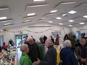 Village shoppers indoors at the farmers' market 