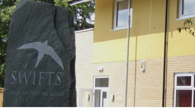 Image of the Fulbourn Library and the marker stone for the Swifts